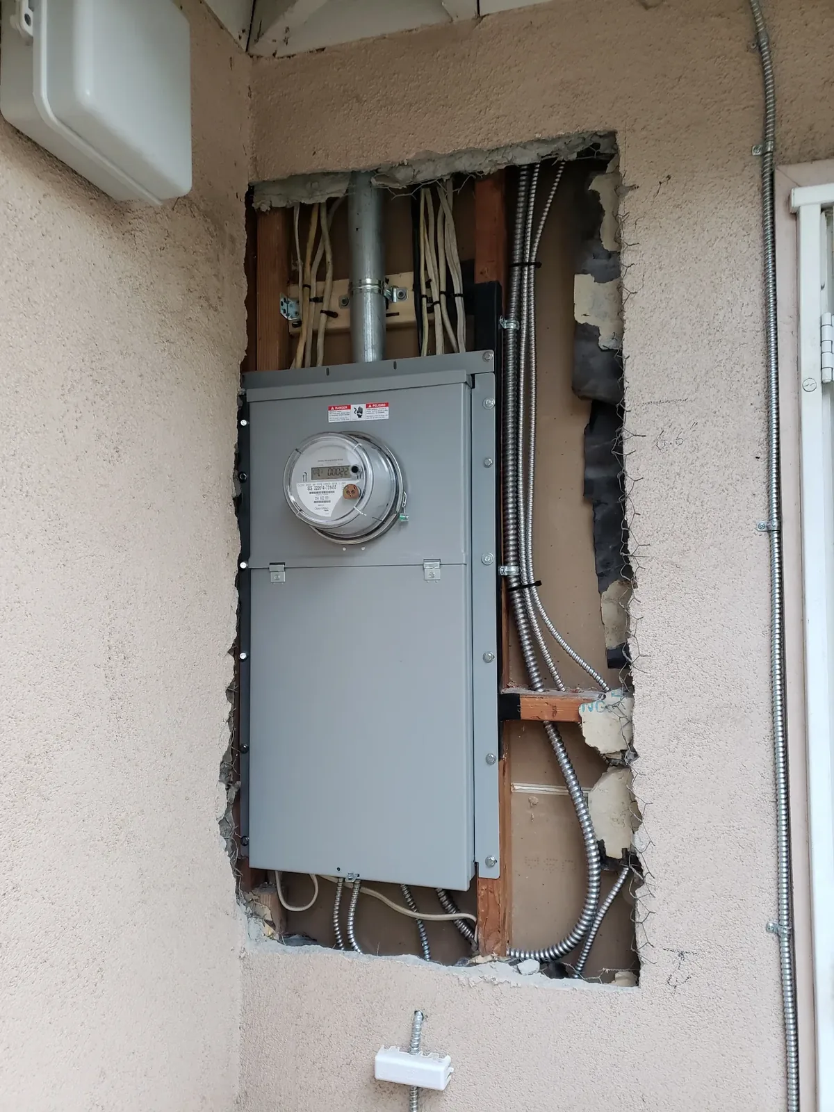 Electrical service panel and meter installation during a residential panel upgrade